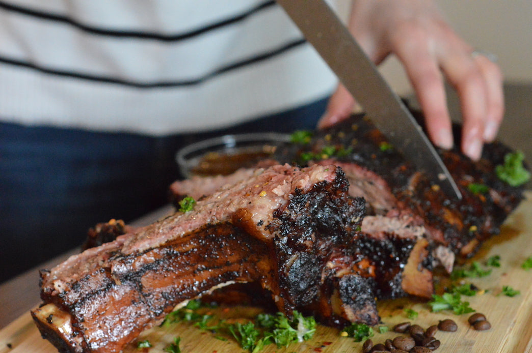 Grilling Beef Ribs Over Applewood Smoking Chips